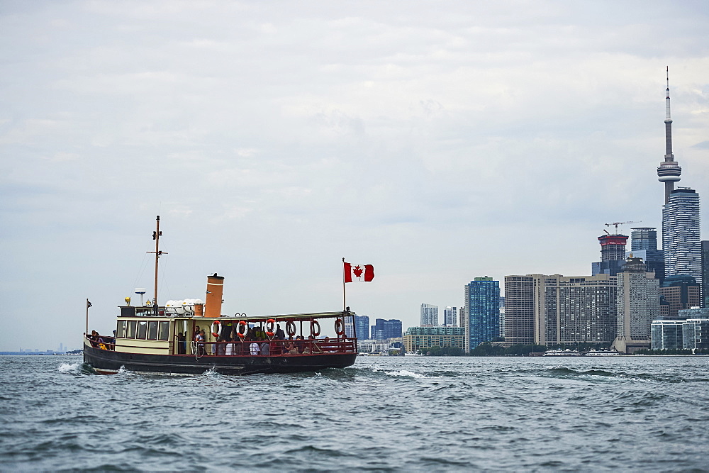 Royal Canadian Yacht Club (RCYC) launch heading to the Toronto island at dawn, Toronto, Ontario, Canada