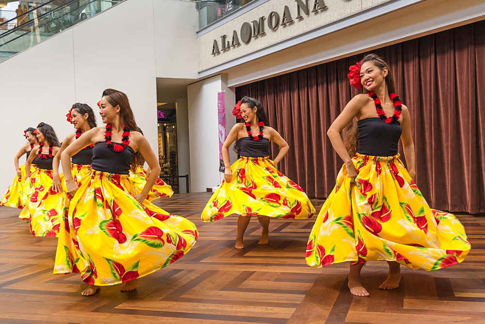 Hula dancers entertaining shoppers at the Ala Mona Shopping Center's stage in Waikiki, Honolulu, Oahu, Hawaii, United States of America