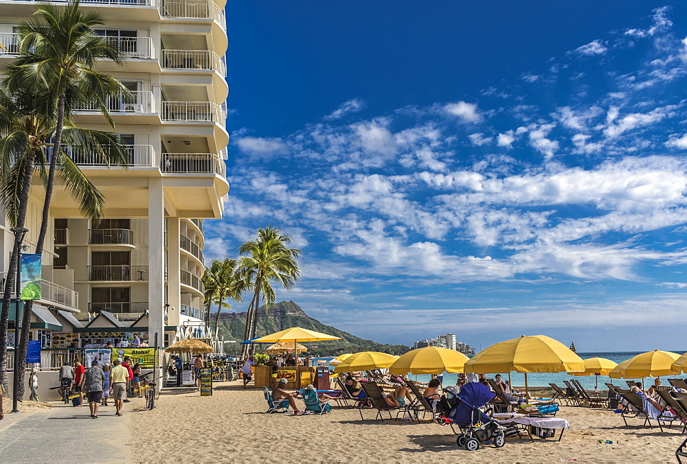 East end of Fort DeRussy boardwalk and beach umbrellas on Waikiki Beach with Diamond Head in the background, Waikiki, Honolulu, Oahu, Hawaii, United States of America