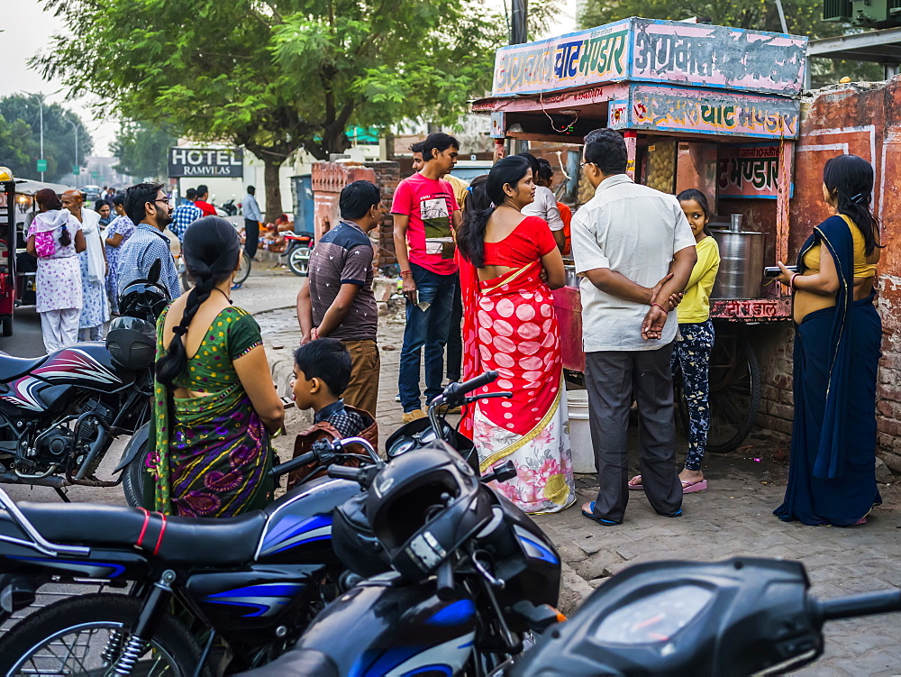 People lined up outside a vendor's stall to make a purchase, Jaipur, Rajasthan, India