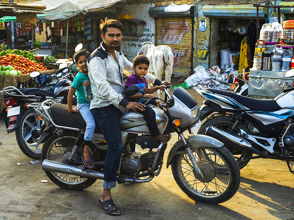 Father with two young sons on a motorcycle, Jaisalmer, Rajasthan, India