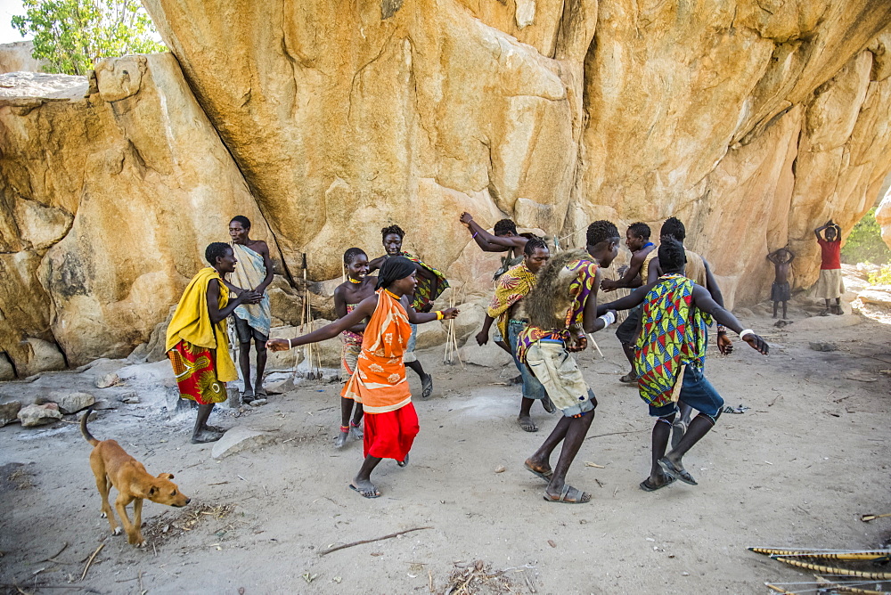 Hadzabe men and women dance and sing after a successful morning hunt near Lake Eyasi, Tanzania