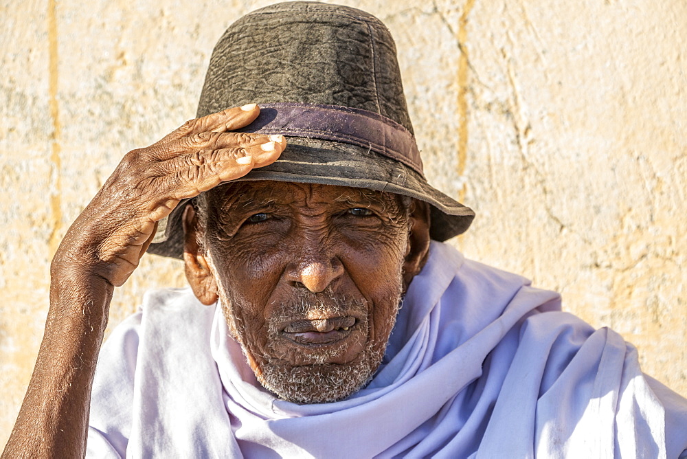 Portrait of an Eritrean man wearing a hat and looking into the camera, Monday livestock market, Keren, Anseba Region, Eritrea