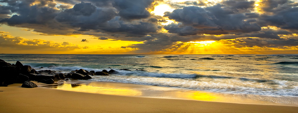 Sunrise from a beach on the coast of Kauai, Kauai, Hawaii, United States of America