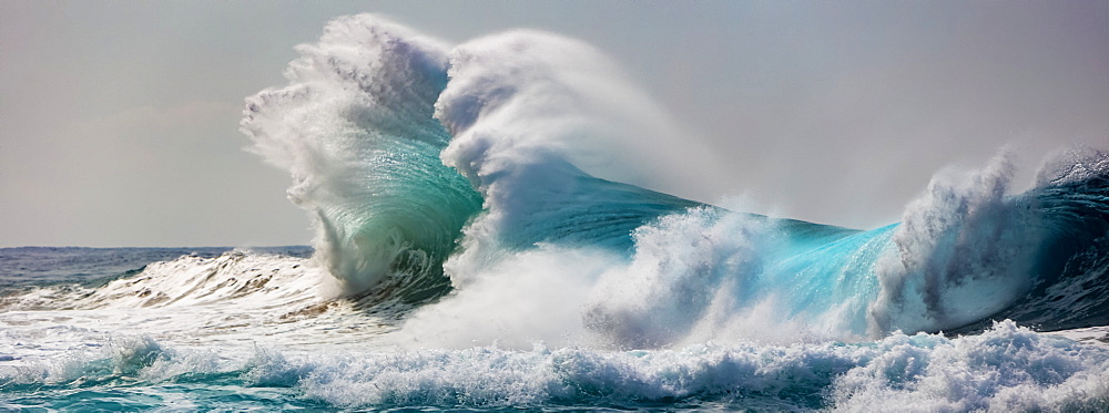 Ocean waves crashing into the shore off the Na Pali coast, Kauai, Hawaii, United States of America