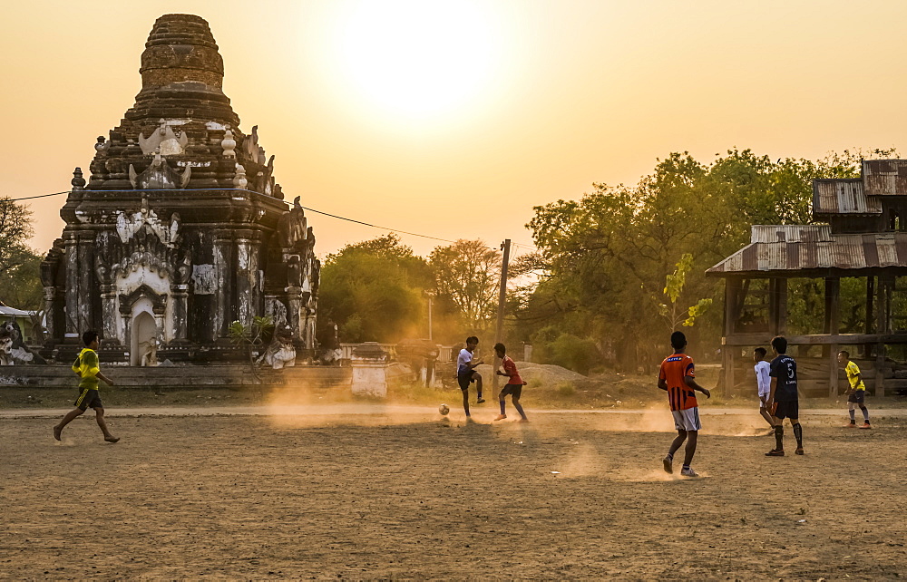 Boys playing football at sunset, Bagan, Mandalay Region, Myanmar