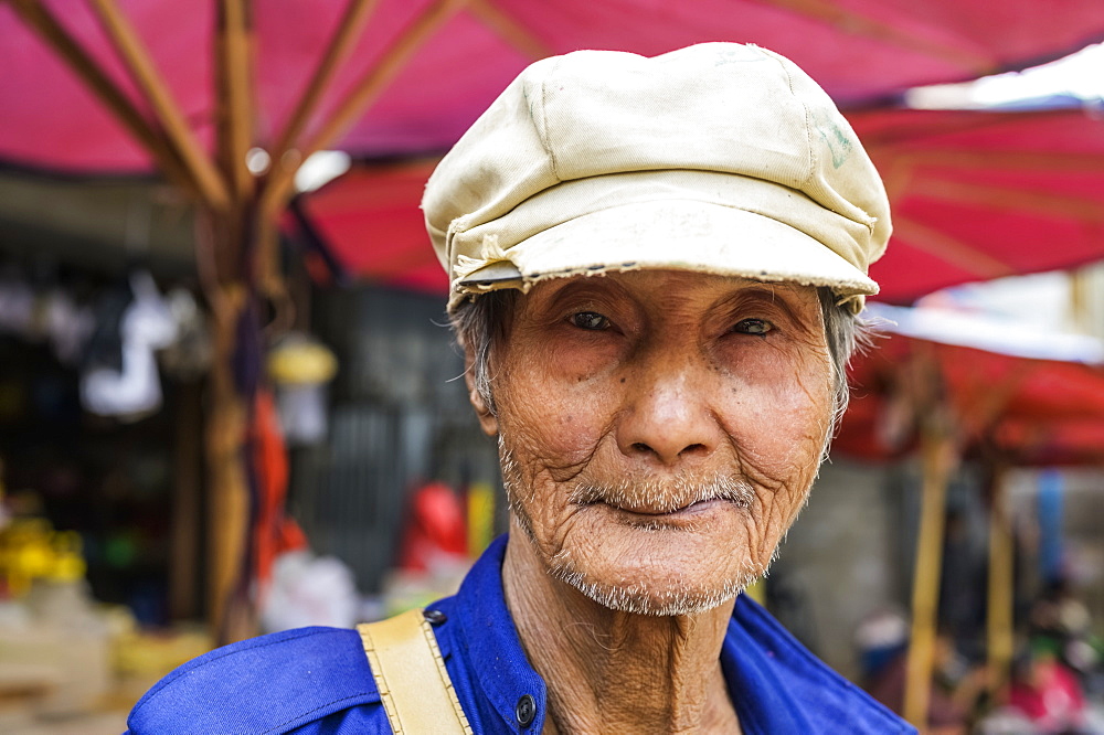 Portrait of a senior man wearing a hat at the market, Taungyii, Shan State, Myanmar