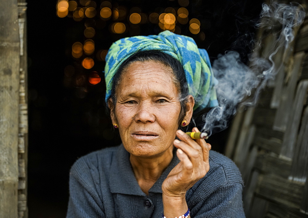 Senior woman smoking a cheroot, Taungyii, Shan State, Myanmar