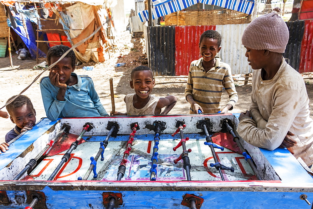 Ethiopian boys playing table football, Koka Reservoir (Lake Gelila), Oromia Region, Ethiopia