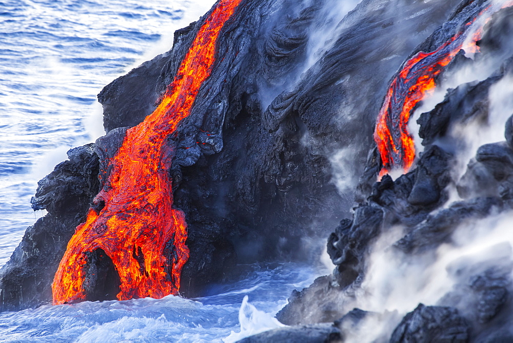 The Pahoehoe lava flowing from Kilauea has reached the Pacific ocean near Kalapana, Big Island, Island of Hawaii, Hawaii, United States of America