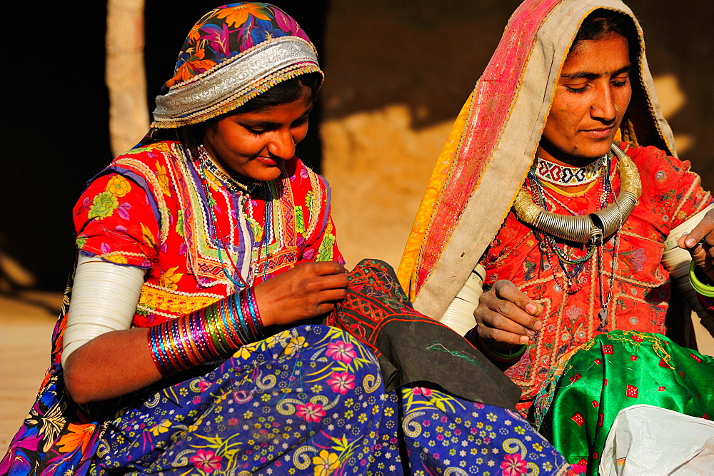 Mir tribal women with traditional attire doing embroidery work, Gujarat, India, Asia