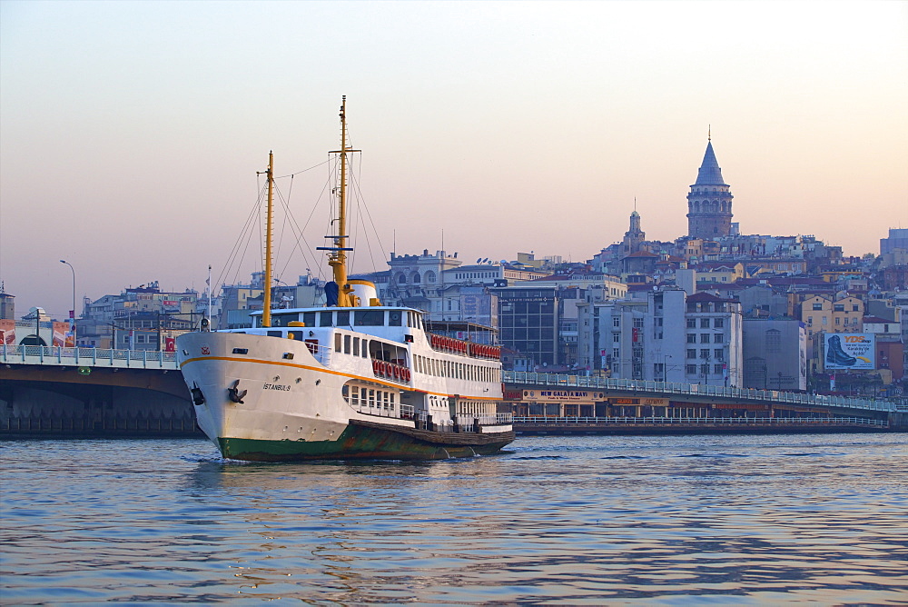 Ferry boat in Golden Horn with Galata Tower in background, Istanbul, Turkey, Europe 