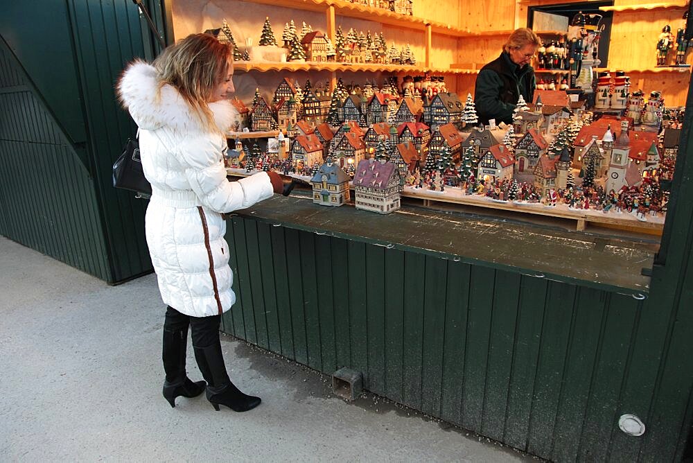 Woman looking at Christmas ornaments, Salzburg, Austria, Europe