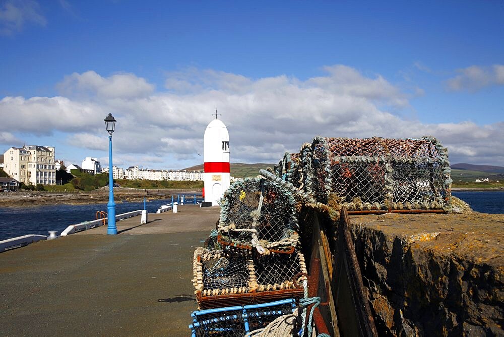 Lobster pots, blue lamppost and Lighthouse, Isle of Man, British Isles, Europe