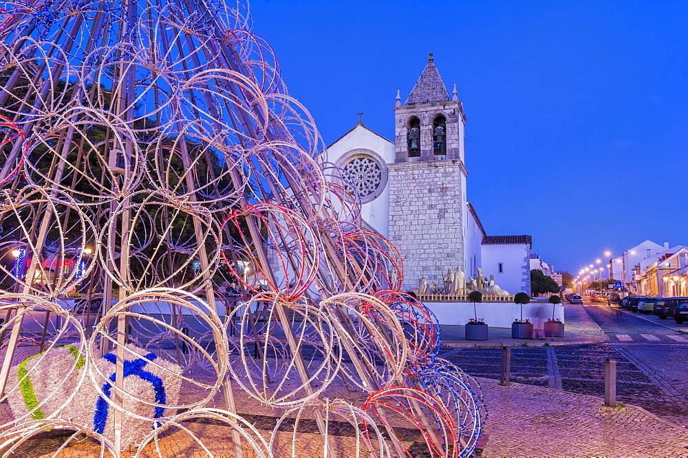 Illuminated modern Christmas tree in front of the Parish Church, Alcochete, Setubal Province, Portugal, Europe