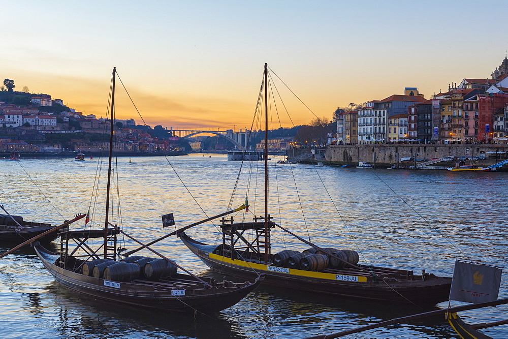 Sunset over Ribeira district and the River Douro with Rabelos, UNESCO World Heritage Site, Oporto (Porto), Portugal, Europe