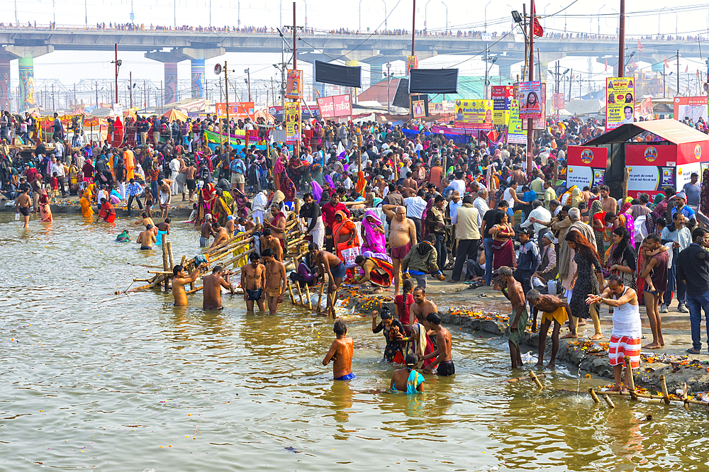 Pilgrims waiting to enter the Ganges river for the ritual bathing, Allahabad Kumbh Mela, Allahabad, Uttar Pradesh, India, Asia