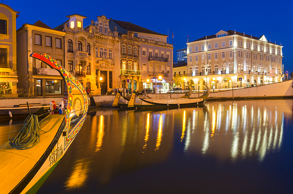 Moliceiros moored along the main canal at sunset, Aveiro, Venice of Portugal, Beira Littoral, Portugal, Europe