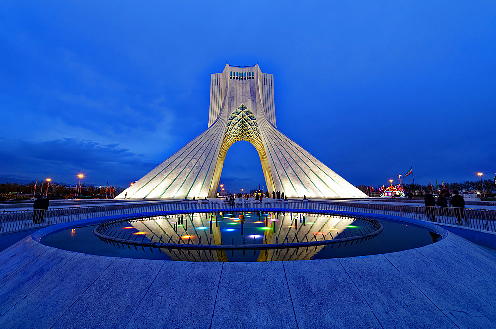 Azadi Tower (Freedom Monument) and cultural complex reflecting in a pond at sunset, Tehran, Islamic Republic of Iran, Middle East