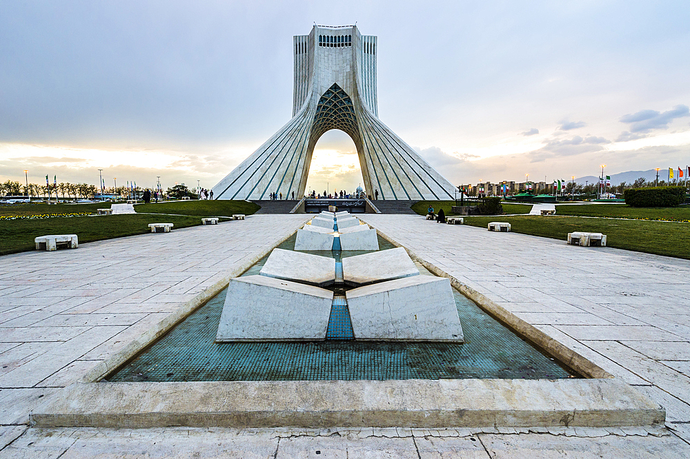 Azadi Tower (Freedom Monument) formerly known as Shahyad Tower and cultural complex at sunset, Tehran, Islamic Republic of Iran, Middle East