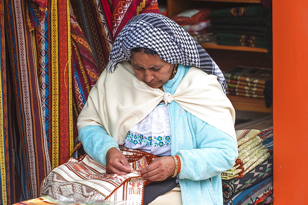 Woman embroidering, Otavalo market, Imbabura Province, Ecuador, South America