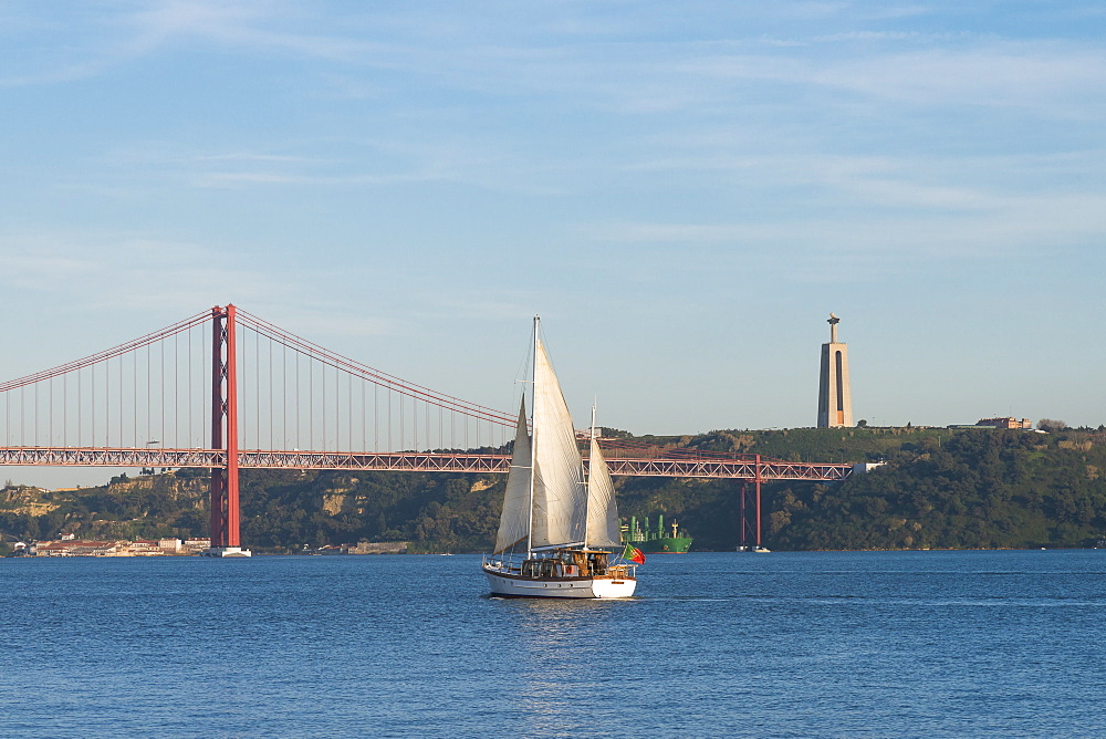 Sailboat navigating on the Tagus River near the Ponte 25 de Abril, Belem, Lisbon, Portugal, Europe