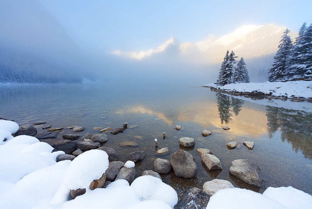 Foggy sunrise at Lake Louise, Banff National Park, UNESCO World Heritage Site, Rocky Mountains, Alberta, Canada, North America