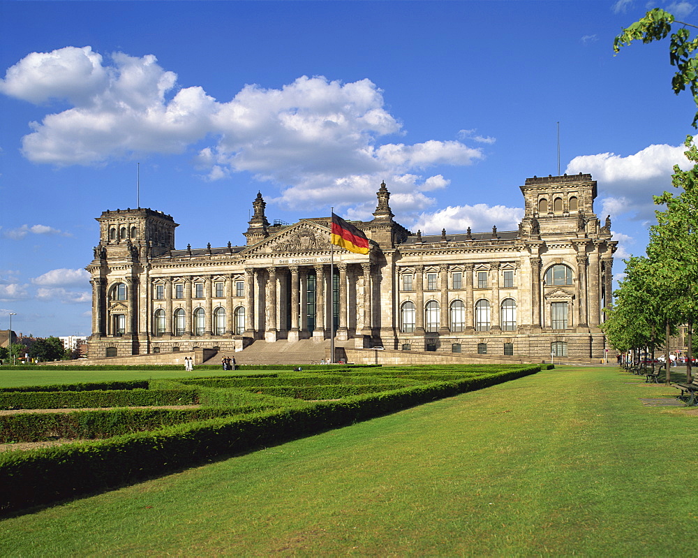 The German flag flies in front of the Reichstag in Berlin, Germany, Europe