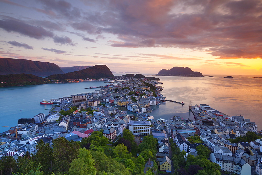 Elevated view over Alesund illuminated at sunset, Sunnmore, More og Romsdal, Norway, Scandinavia, Europe 