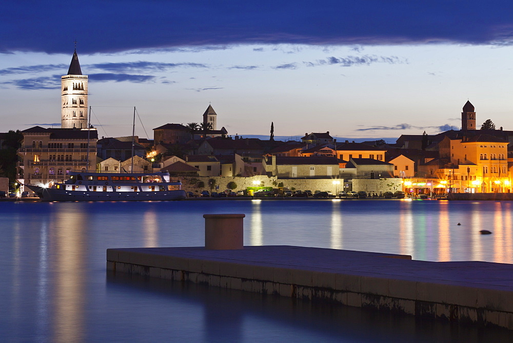 Old town of Rab town with Belfry of St. Justine's church, great bell tower of St. Mary's church, campanile of church of St. John and campanile of monastery of St. Andrew at dusk, Rab town, Rab Island, Kvarner region, Dalmatia, Adriatic Sea, Croatia, Europe