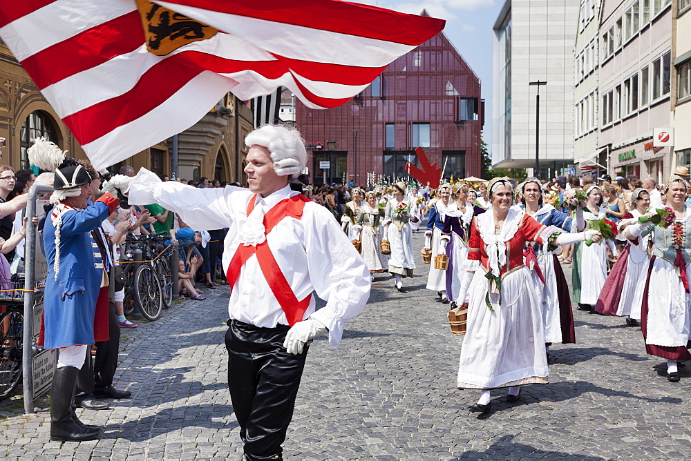 Flag thrower and fisher women in a historical parade at the market place, Fischerstechen, Ulm, Baden Wurttemberg, Germany, Europe