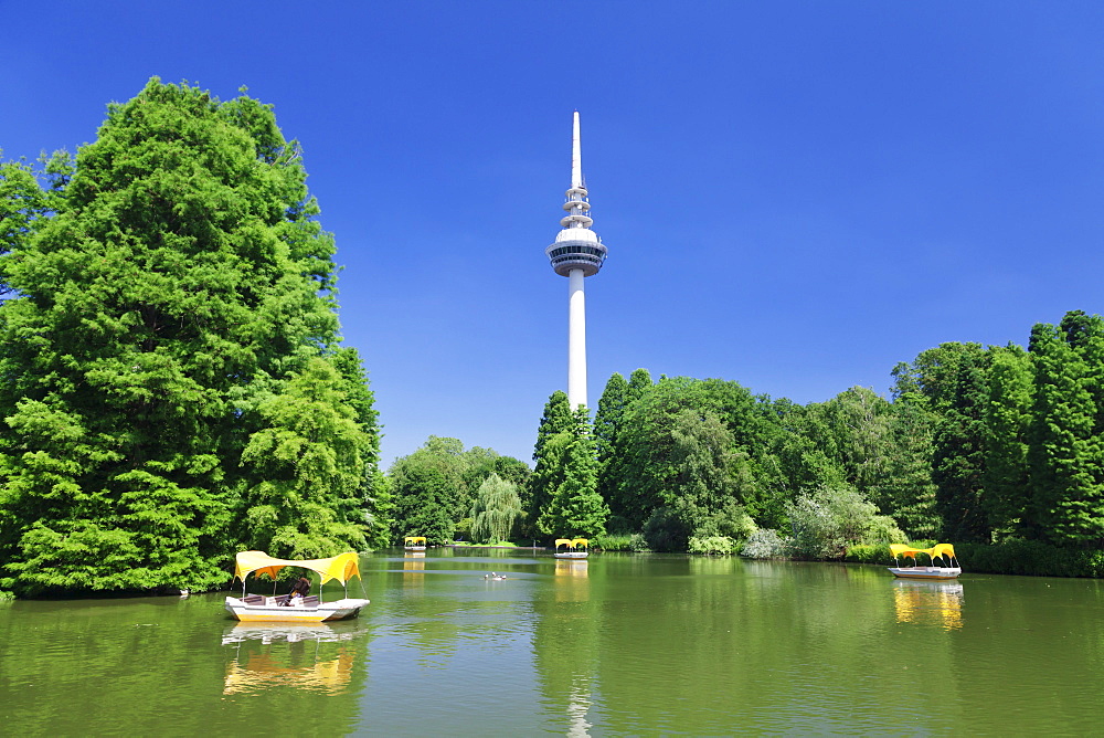 Boat trip at Kutzenweiher Lake, Luisenpark, municipal park, and telecommunication tower, Mannheim, Baden Wurttemberg, Germany, Europe