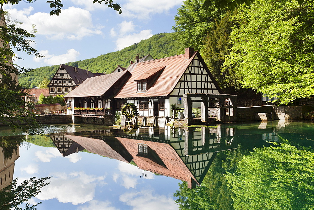 Mill reflecting in Blautopf Spring, Blaubeuren, Swabian Alb, Baden Wurttemberg, Germany, Europe