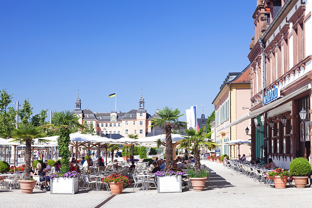 Street cafes and Schloss Schwetzingen Palace, Schwetzingen, Rhein-Neckar-Kreis, Baden Wurttemberg, Germany, Europe