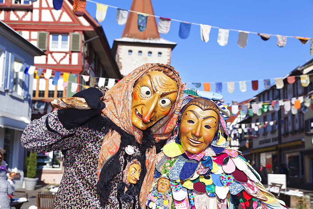 Couple in traditional costumes of Witch and Spattlehansel, Swabian Alemannic carnival, Gengenbach, Black Forest, Baden Wurttemberg, Germany, Europe 