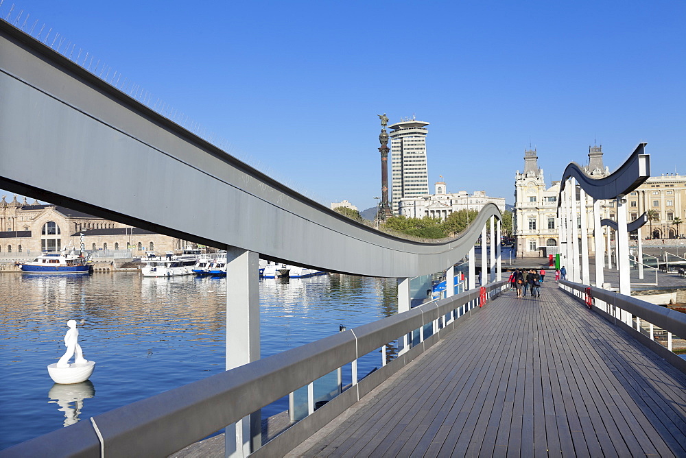 Rambla del Mar at Port Vell, Edificio Colon Tower and Columbus Monument (Monument a Colom), Barcelona, Catalonia, Spain, Europe