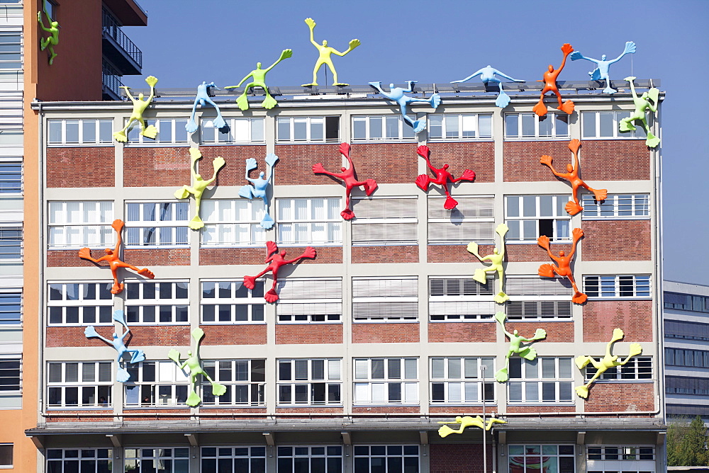 Flossies figures covering the Roggendorfer Haus, Media Harbour (Medienhafen), Dusseldorf, North Rhine Westphalia, Germany, Europe 