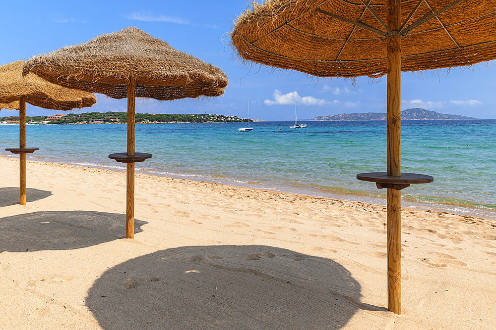 Straw parasols, Porto Pollo Beach, Porto Puddu, Gallura, Sardinia, Italy, Mediterranean, Europe