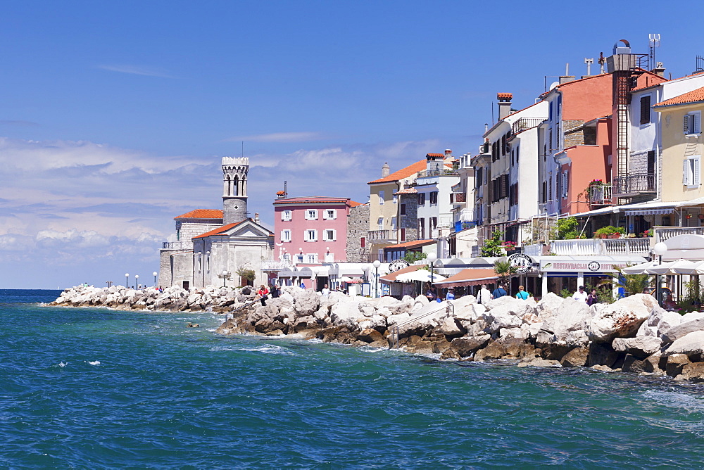 Promenade and church of Santa Clemente at sunset, Piran, Istria, Slovenia, Europe