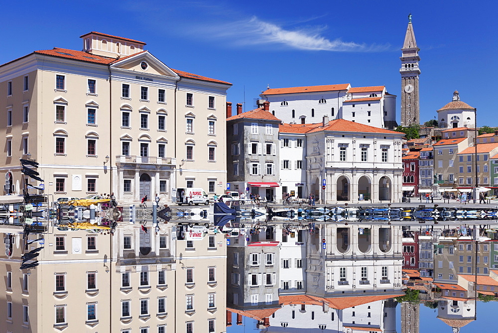 Waterfront buildings at the harbour and bell tower of Cathedral of St. George, Piran, Istria, Slovenia, Europe 