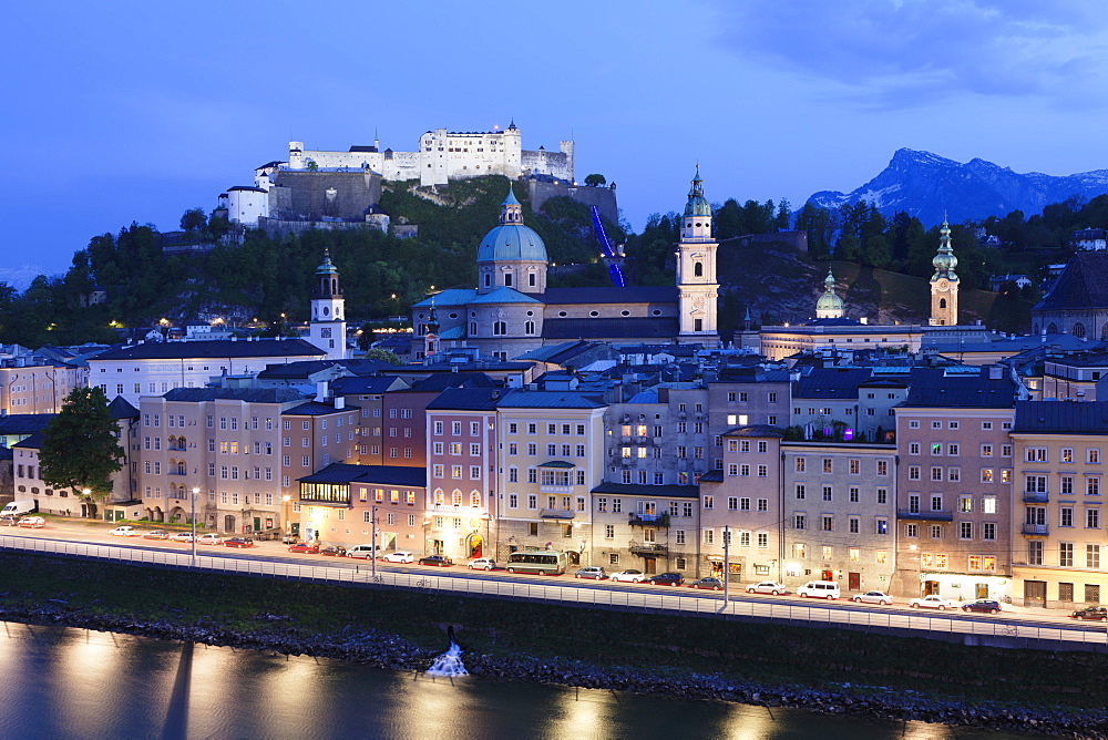 High angle view of the old town, UNESCO World Heritage Site, with Hohensalzburg Fortress, Dom Cathedral and Kappuzinerkirche Church at dusk, Salzburg, Salzburger Land, Austria, Europe 