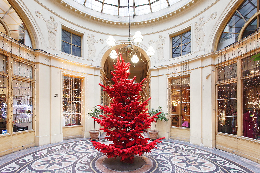 Red Christmas tree at Galerie Vivienne, Paris, Ile de France, France, Europe