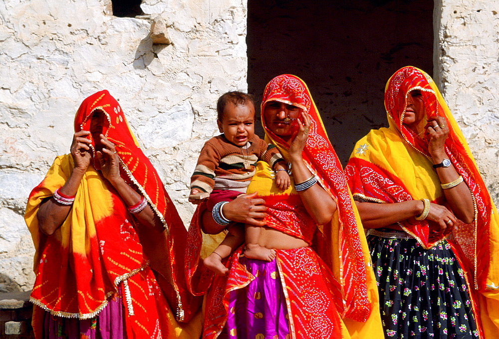 Veiled women with a child at Nalu Village, Rajasthan, India