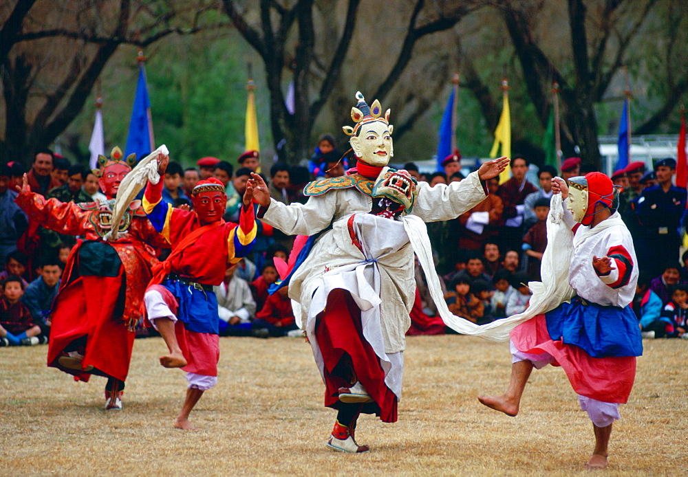 Mask dancing enacting tales of Buddhist legend during a festival in Bhutan