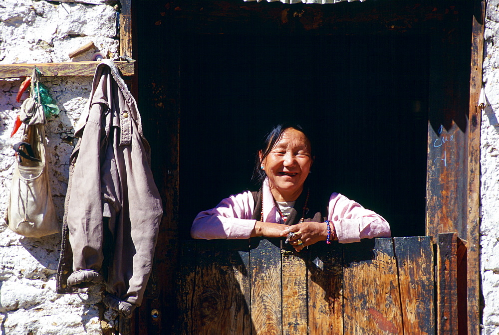 Woman at doorway, Paro, Bhutan