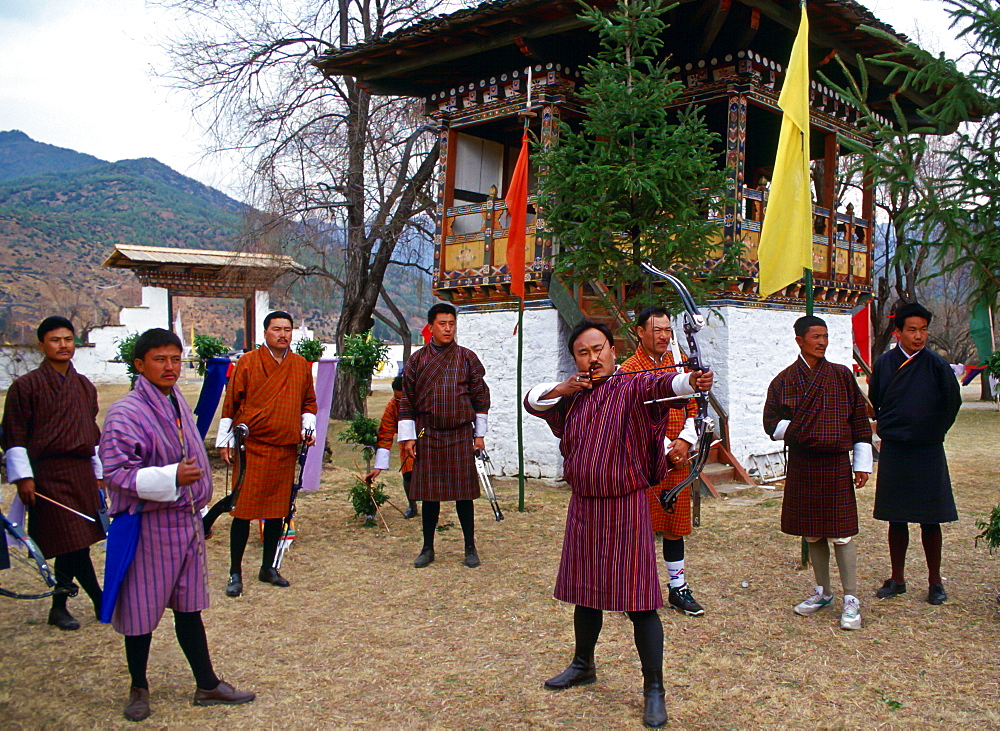 Archery contest with high-technology bows and arrows.  Archery is the national sport in Bhutan