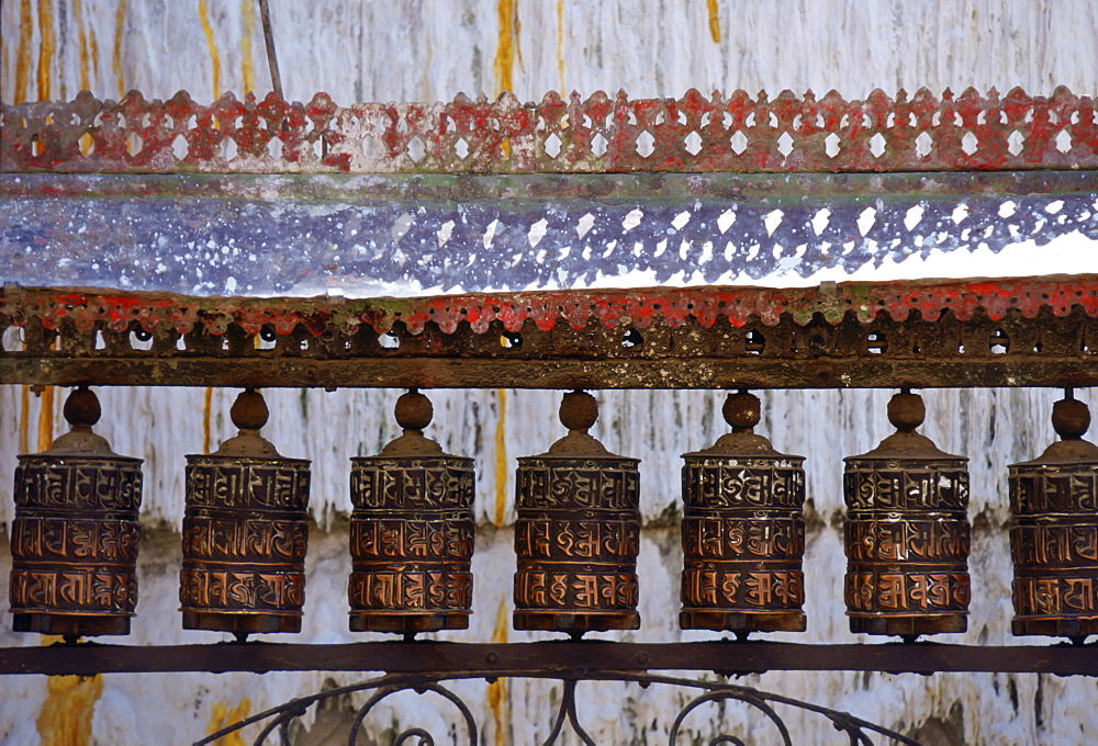 Ornately carved Buddhist prayer wheels at Swayambhunath Stupa  Buddhist monument in Nepal.