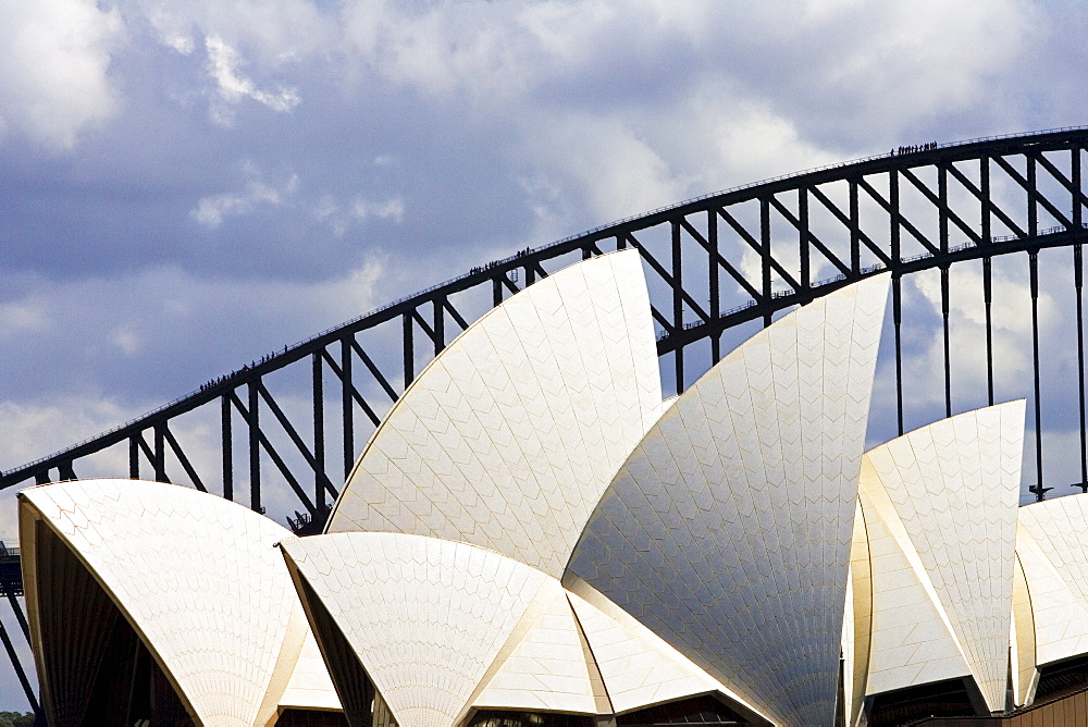 Sydney Opera House and tourists walking over  the Sydney Harbour Bridge walkway, Australia