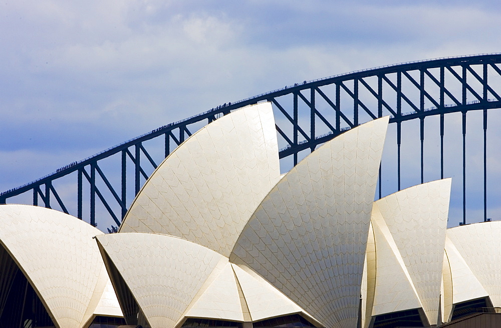 Sydney Opera House and tourists walking over  the Sydney Harbour Bridge walkway, Australia