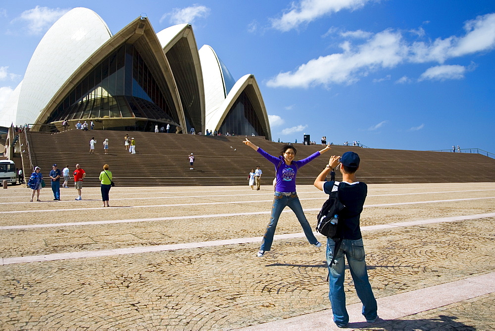 Tourists taking photographs at Sydney Opera House,  New South Wales, Australia